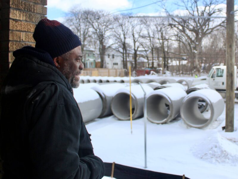 Gerald Patton, Jefferson Chalmers resident, looks at construction outside his home.
